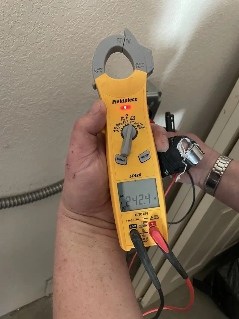 Voltage testing with clamp meter during Outlet Installation in Litchfield Park